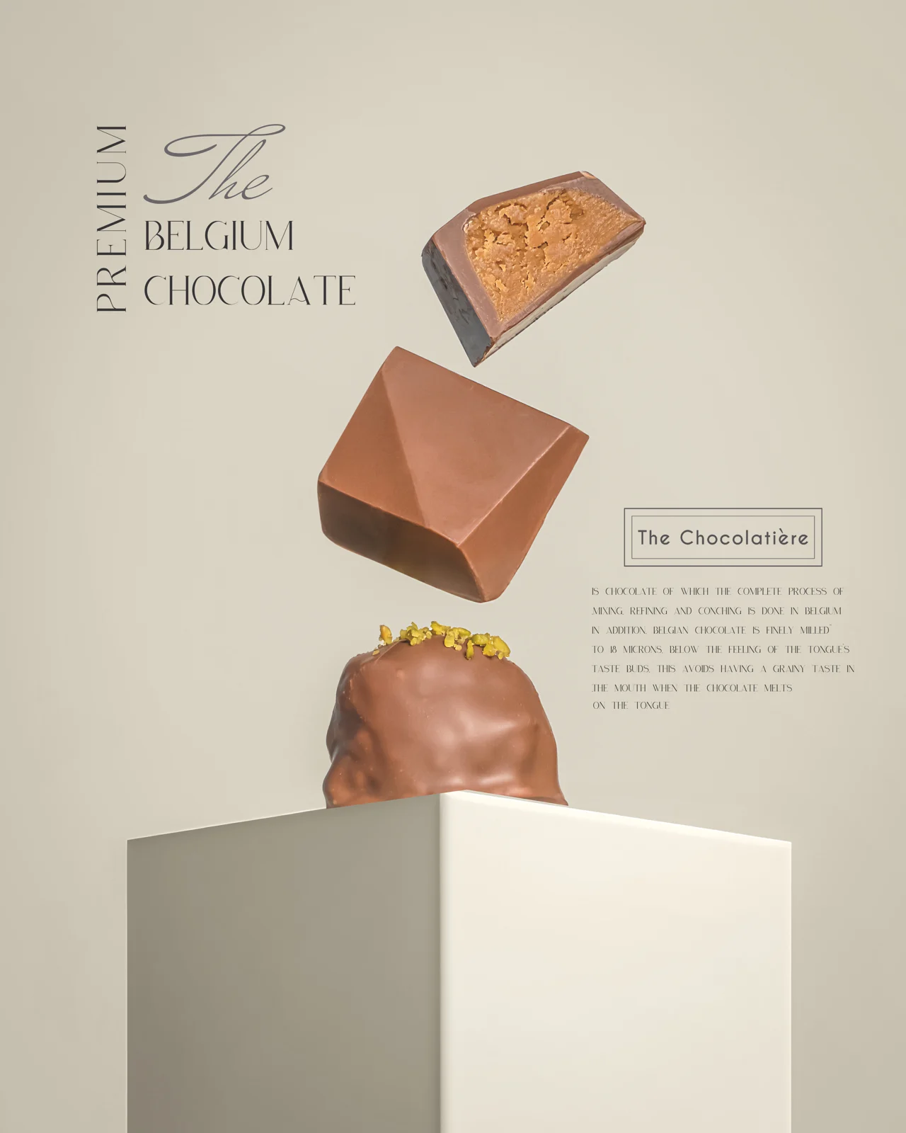 Sculptural floating chocolates, cream plinth and editorial typography.