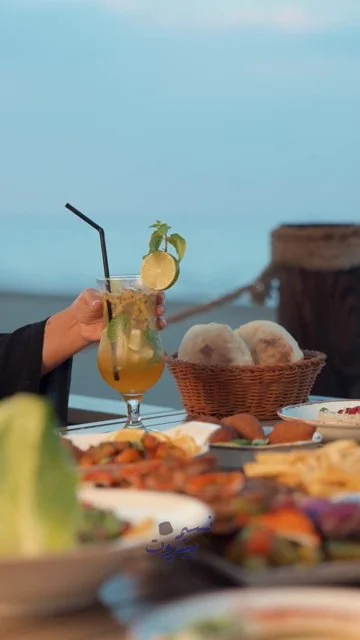 Day-to-evening dining, food and drink details, guests and seaside setting.